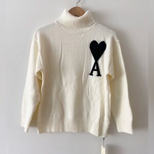 Designer Inspired Cream Turtleneck Sweater with Black Heart Accent